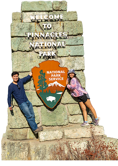Ace and Fai on Sign, Pinnacles National Park, California, United States